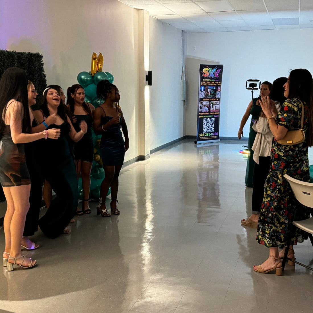 Guests posing on the Sky Photo Booths 360 video booth at a Houston event